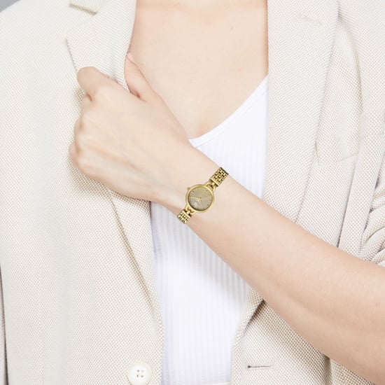 Titan Raga Showstopper Quartz Analog Silver Dial Golden Metal Strap Watch For Women nu95349ym01